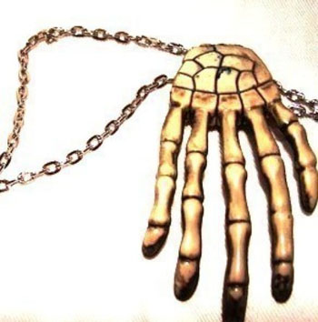 Show product details for Skeleton Hand Necklace by Little Angels