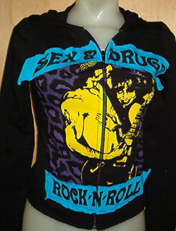Groupie With Sex & Drugs Rock & Roll Sewn On Patches on a black long sleeve fitted hooded girls shirt