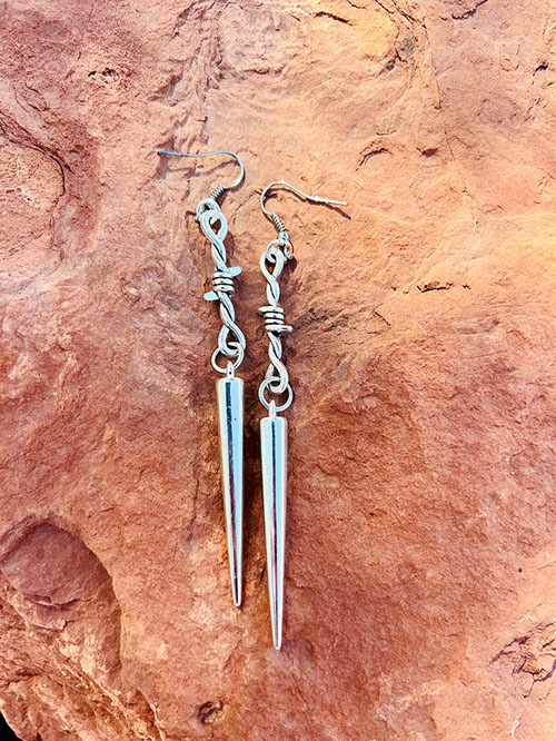 Spike dangle earrings deals