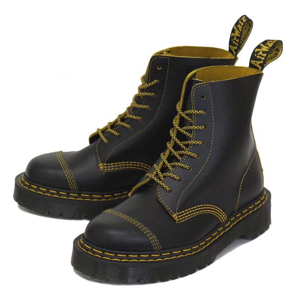 black shoes with yellow stitches