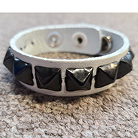 1 Row Of Black Pyramids On A White Leather Bracelet by Funk Plus