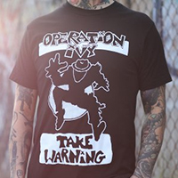 Operation Ivy- Take Warning on a black ringspun cotton shirt